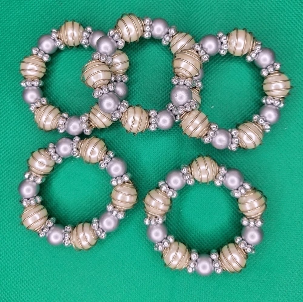Set of 5 unbranded  super cute dining napkin rings.